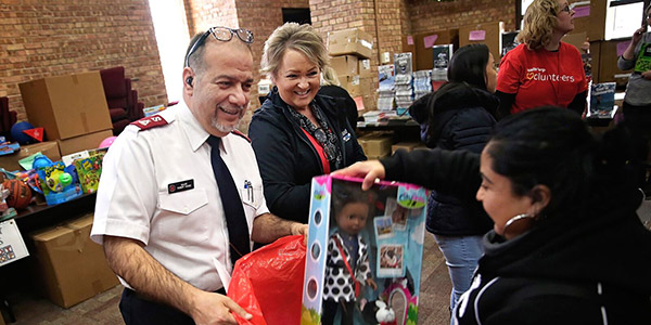 man giving toy to woman